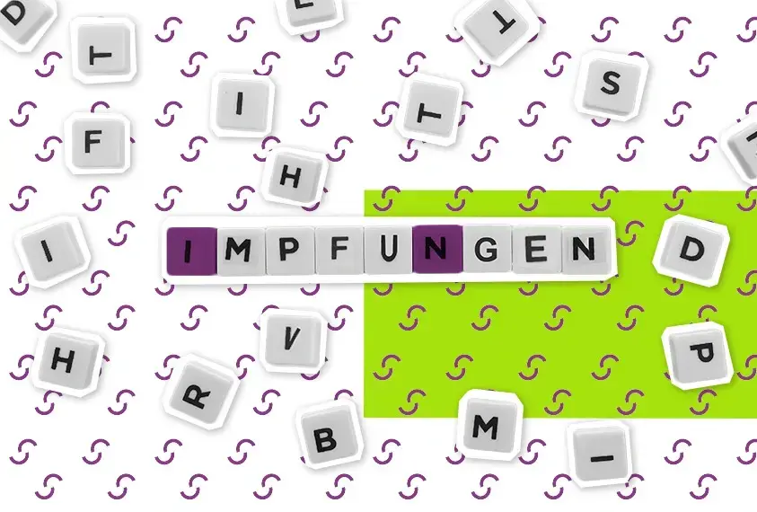 Buchstabentafeln, die das Wort Impfungen ergeben 